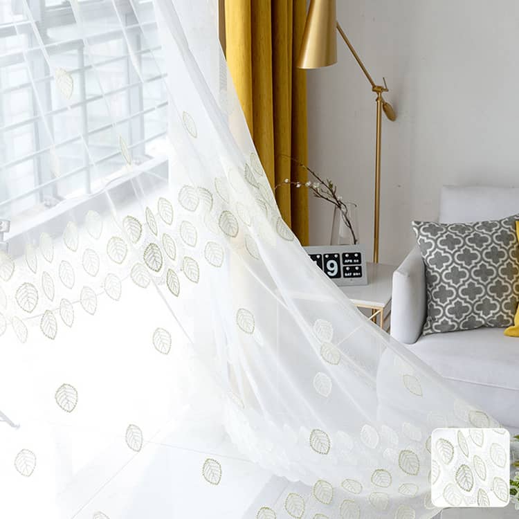 裾から伸びるイエローのリーフ柄